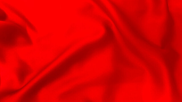 A close up of red silk fabric with soft folds. A textile backdrop for clothing, upholstery, accessories, and decor.