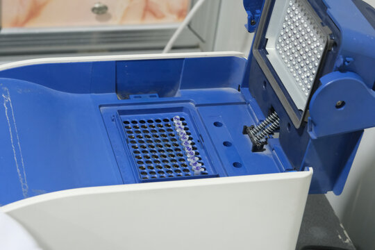 BASRA, IRAQ - NOVEMBER 7, 2021: CLOSEUP PHOTO OF PUTTING PCR TUBES THE THERMOCYCLER MACHINE