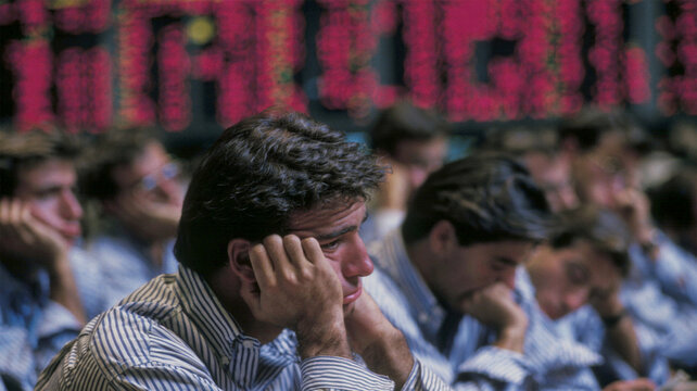 Stressed stock traders reacting to a financial market crash on a busy trading floor, capturing economic uncertainty and stock exchange volatility