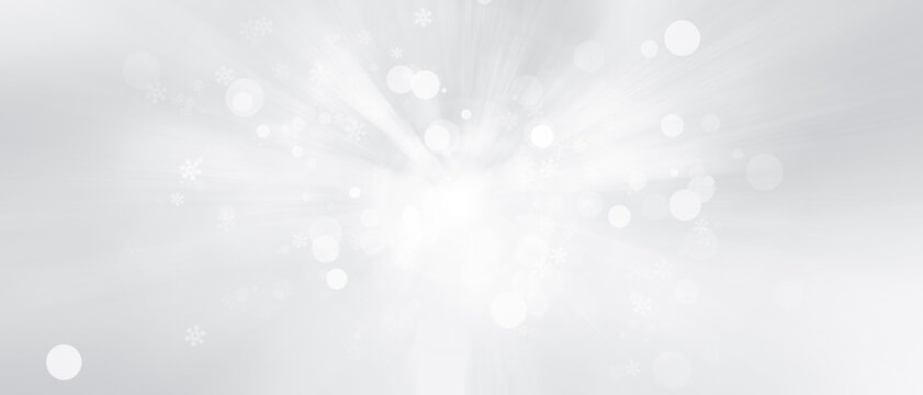 Blurred glitter effects background. Bright soft blue with hints of pearl color. Christmas background. Festive Christmas backdrop with holiday charm. Blurred bokeh light on dark blue background.