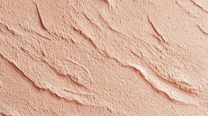 Naklejka premium Close-up of a textured, peach-colored wall surface with rough, uneven plaster and natural cracks an abstract pattern, texture pink background
