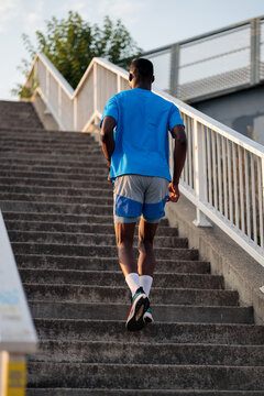 Athlete running up stairs doing urban workout training