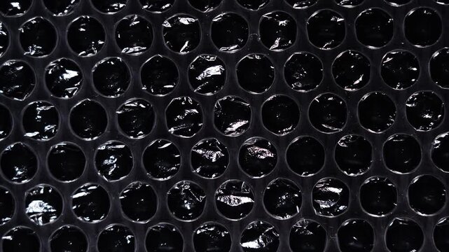 Small Bubble Wrap Texture on Black Background
