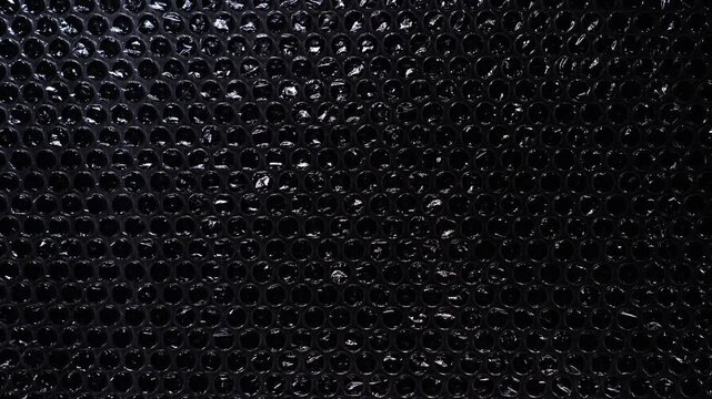 Large Bubble Wrap Cells on Black Background