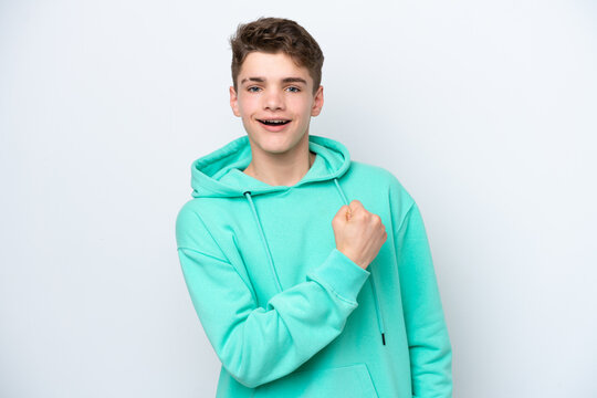 Teenager Russian man isolated on white background celebrating a victory