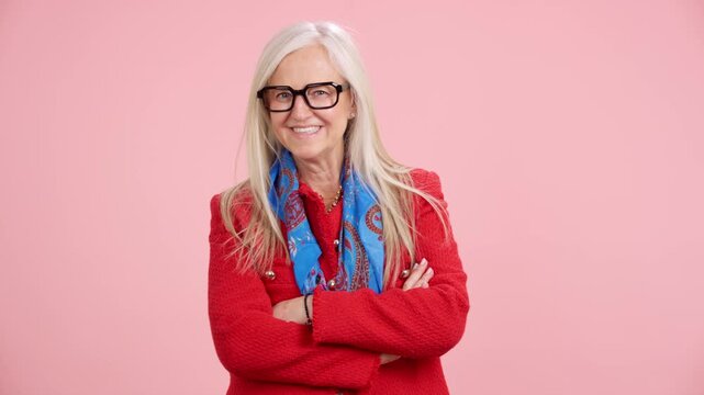 Elegant senior woman with glasses smiling confidently