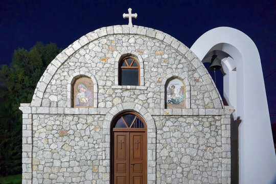Traditional Greek Orthodox stone chapel with bell arch at night in Kolymbia Rhodes
Greece