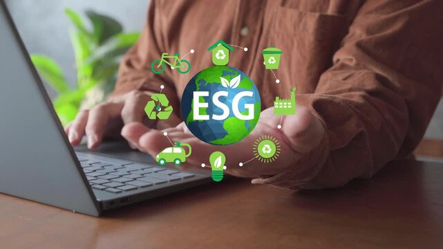 Laptop user presenting an ESG globe with recycling and clean-energy icons, illustrating sustainable business, environmental strategy, and corporate responsibility.