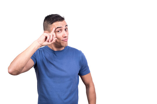 Man with his finger on his forehead gesturing he's thinking