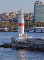 Fototapeta premium White Lighthouse With Red Line at Kadikoy Port in Istanbul Turkey Sunny Autumn Day