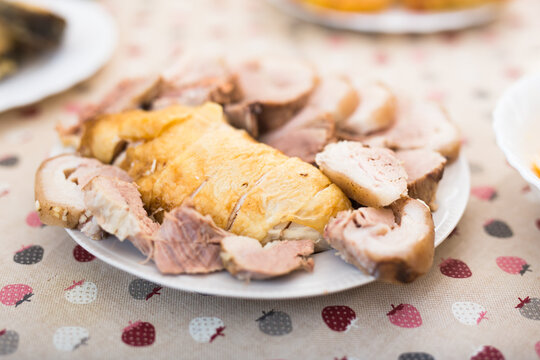 cold cuts of different types of cooked meat on plate