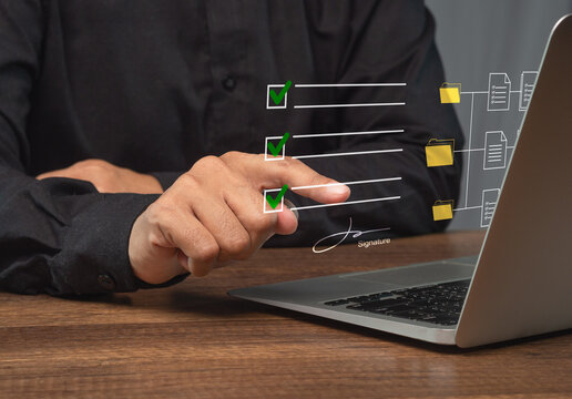 Person reviewing digital document approval checklist on laptop