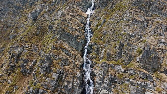 Skakavitsa waterfall Rila mountain aerial view drone shot, Bulgarian national park mountain river stream summer landscape, Rila mountains cascades rock cliff travel destination outdoor background