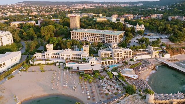 Saints Constantine and Elena Bulgaria beach lagoon aerial view drone shot sunset, Bulgarian Black Sea resort hotel waterfront, luxury bay summer travel destination background