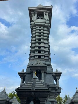 Majestic grey stone Kirti Stambh monument tower at Shani Shingnapur in Maharashtra India