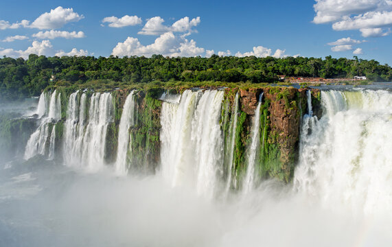 Scenic view of a massive waterfall cascading over lush green cliffs in Brazil
