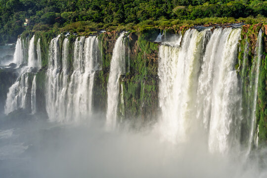 Scenic view of a massive waterfall in the lush tropical rainforest of Brazil