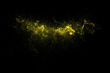 Fototapeta premium Yellow powder explosion against a black background a dynamic particle spray effect