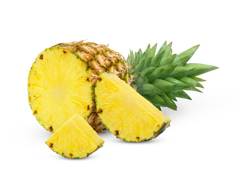 Isolated pineapples. Fresh unpeeled half of pineapple fruit and cut in slice isolated. 