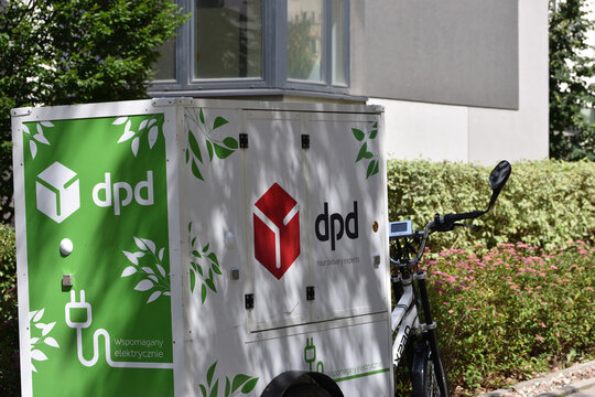 DPD Dynamic Parcel Distribution electric trike for delivery, close up. WARSAW, POLAND - JUNE 18, 2026