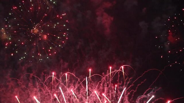 Amazing real beautiful colorful fireworks background on celebration night event for happy new year party or independence day, Abstract Multi color golden firework in the night sky