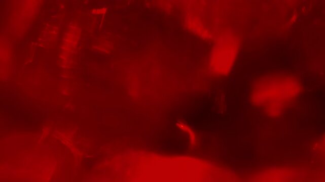Slow Shifting Light Refraction Inside Ruby Crystal Mass - Abstract Red Motion Background and Video Overlay⁠