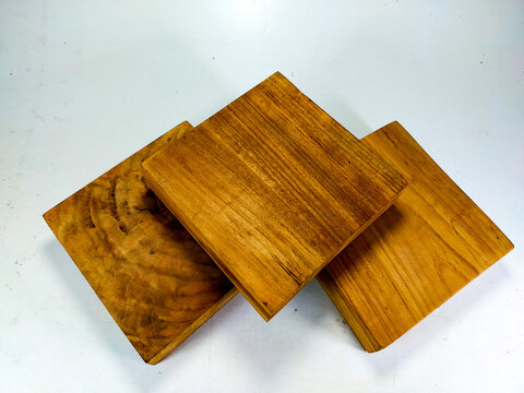 pieces of teak wood planks with a smooth texture