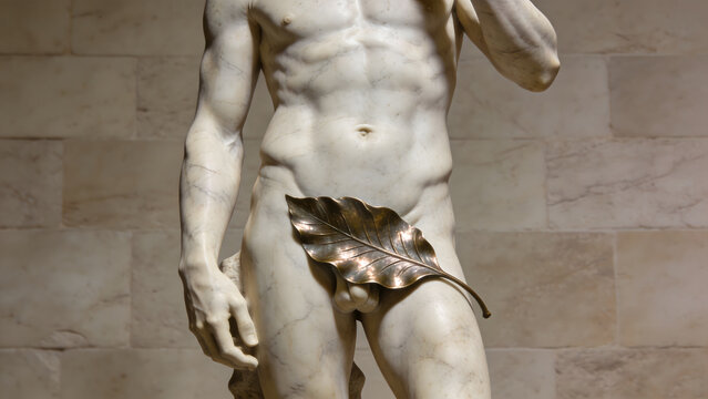 Classical marble sculpture of a male torso with bronze leaf covering.