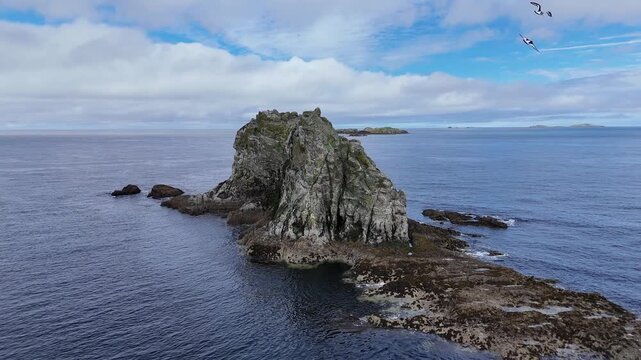 Drone orbit of sea stack off the coast near Malin Head Donegal Ireland 4K