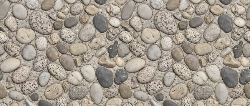 Stone texture displaying a beautiful natural grey pebble floor surface with detailed smooth river rocks provides a luxury rustic backdrop for creative design templates