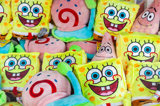 Frankfurt, Germany - May 15, 2026: Pile of plush soft toys of Spongebob Squarepants and Patrick Star characters at a fairground stall in Frankfurt