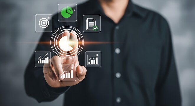 Man's finger pointing to digital pie chart and icons representing business data analysis