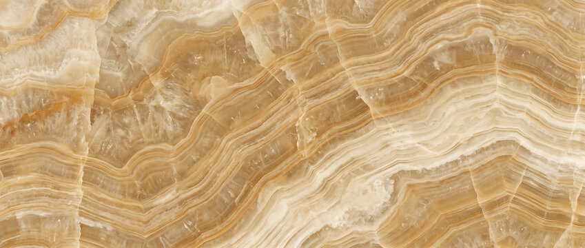 Amber onyx surface featuring layered natural bands with warm honey tones and a smooth polished crystalline stone pattern