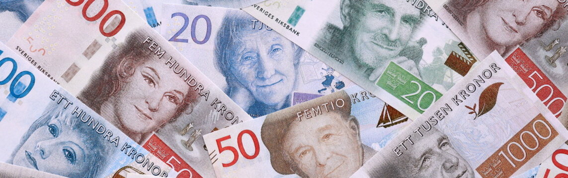 Swedish krona money bills pile on table. Sweden banknotes of SEK currency close up.
