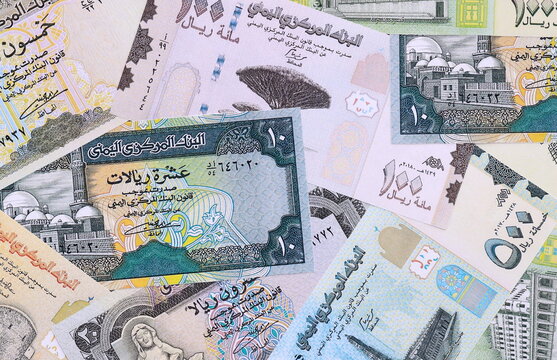 Yemeni rial money bills pile on table. Yemen banknotes of YER currency close up.