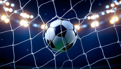 Naklejka premium A soccer ball is caught in a net, with stadium lights in the background