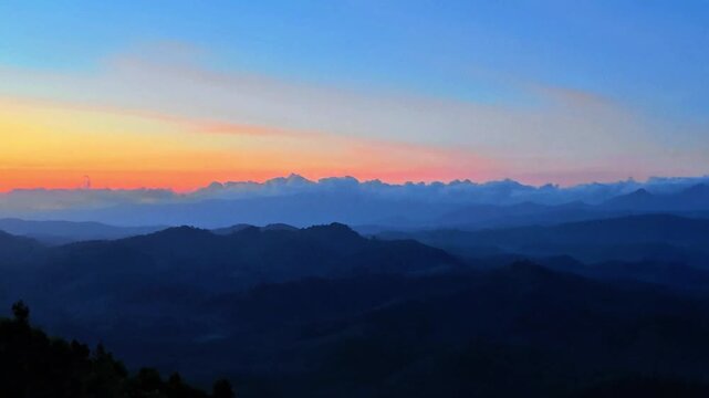 A sweeping panoramic view of densely forested mountains stretching to the horizon under a clear blue sky with soft sunlight. Beautiful natural scenery, ideal for nature, conservation, ecotourism. 4K