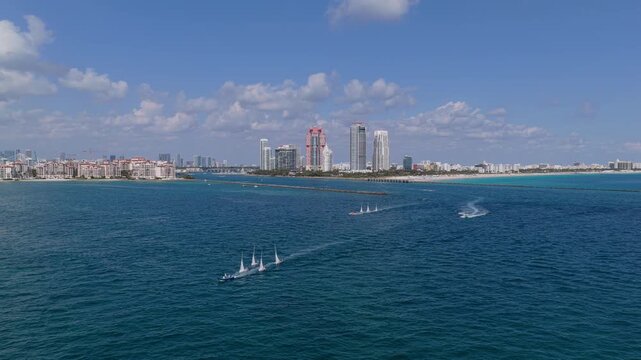 Sail boat at port of Miami. Travel by sea. Seascape horizon landscape. Sea vacation. Sailboat vessel. Miami sailing race. Sail training ship. Sailing boat at blue sky seascape. Ship sailing the sea