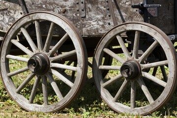 Obraz premium Wooden Wagon Wheels - Rustic Transportation Detail