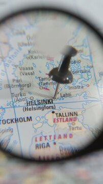 Explore Helsinki with a magnifying glass on a real paper map
