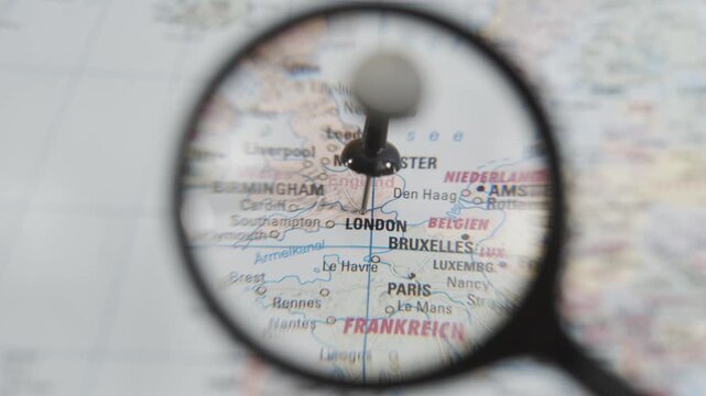 Exploring London on a real paper map with a magnifying glass