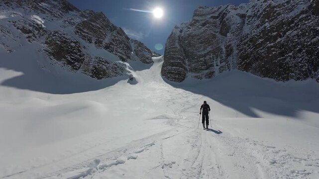 Backcountry Skier Skinning Toward Bell Couloir In The Canadian Rockies Alberta Canada