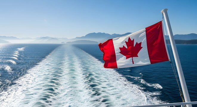 Canadian flag waving on boat in ocean