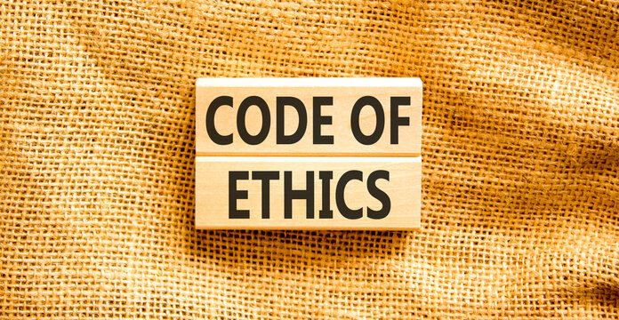 Code of ethics words symbol. Concept words Code of ethics on beautiful wooden blocks. Beautiful canvas background. Business Code of ethics concept. Copy space.