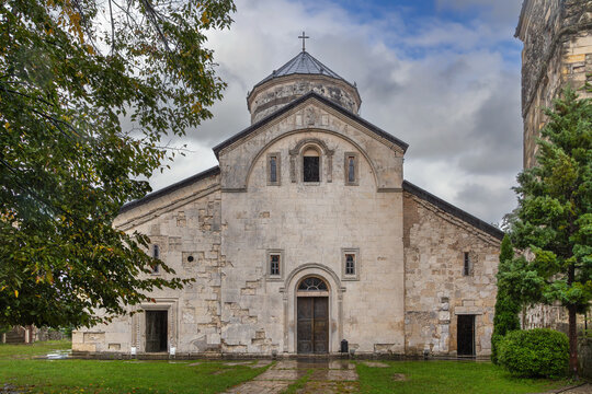 Martvili Monastery cathedral facade in Martvili, Georgia. Front view, cloudy and rainy day, dark sky, medieval style