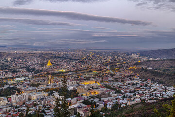 Panoramic view of Tbilisi from Mtatsminda mountain, Georgia. Evening scenic cityscape with soft lighting, travel style © borisb17