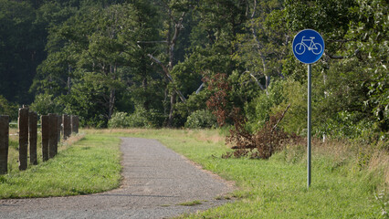 Obraz premium BIKE PATH - A bike trail among parks, forests and meadows