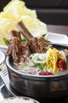 Korean short rib soup galbitang with glass noodles green onion and jujube in stone bowl