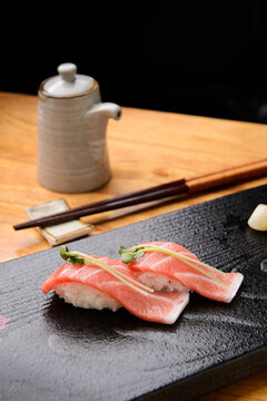 Fresh fatty tuna nigiri sushi with green onion