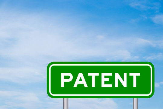 Green color transportation sign with word patent on blue sky with white cloud background